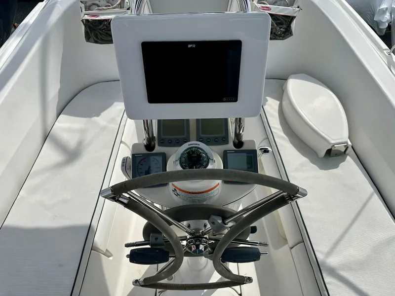 Slide: The Image of 2006 Hunter 31 sailboat cockpit with blue canopy and covered helm. - 21