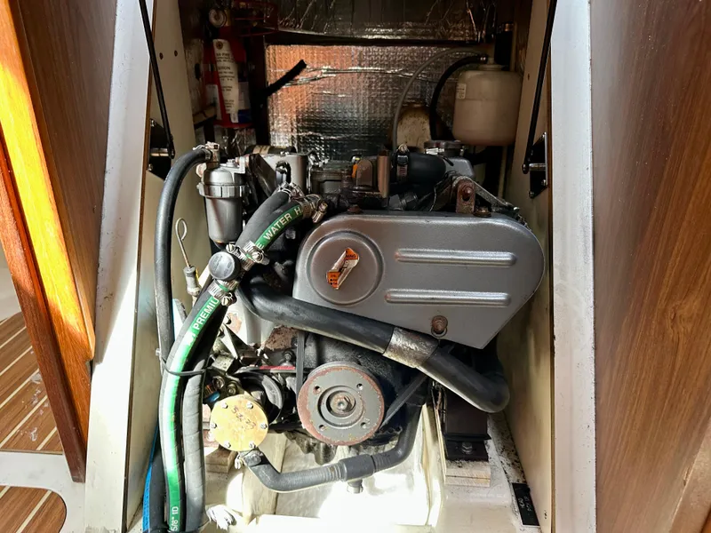 Slide: The Image of Interior cabin of 2006 Hunter 31 sailboat with cozy bedding and porthole. - 42