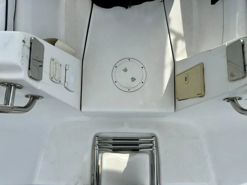 Slide: The Image of 2006 Hunter 31 sailboat cockpit with blue canopy and white seating. - 5