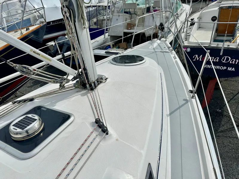Slide: The Image of 2006 Hunter 31 sailboat cockpit with blue canopy and marina view. - 7