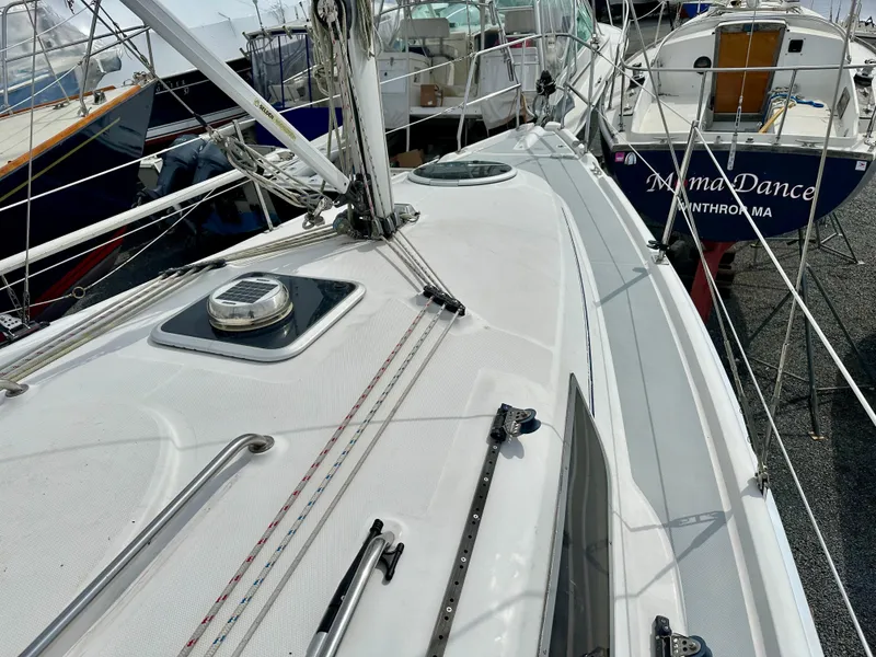 Slide: The Image of Interior view of a 2006 Hunter 31 sailboat cockpit with stainless steel fittings. - 8