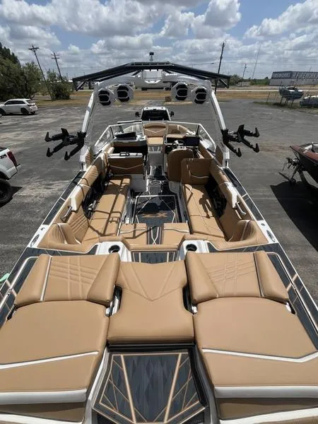 Slide: The Image of 2025 Tigé Ultré 25ZX boat with luxurious seating and modern design. - 2