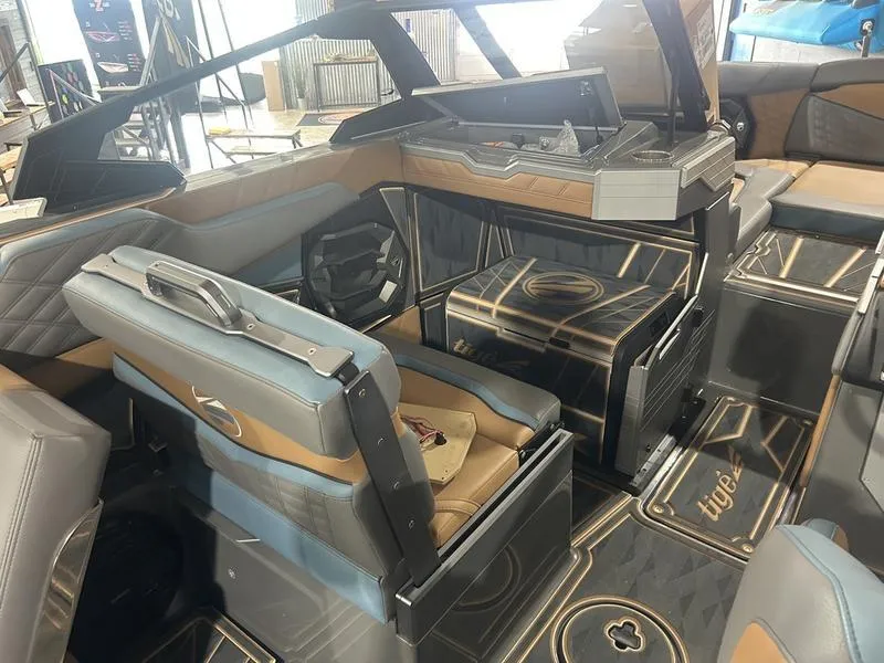Slide: The Image of 2025 Tigé Ultré 25ZX boat interior with luxurious seating and modern design. - 2
