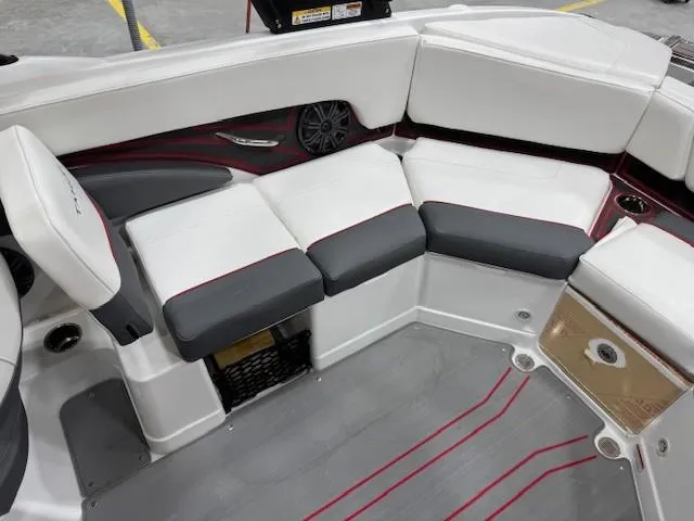 Slide: The Image of 2024 Tahoe 210 S boat interior with white and gray seating, modern design. - 7