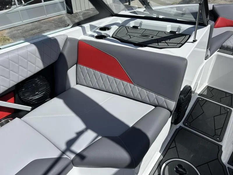 Slide: The Image of 2025 Tigé Z1 boat interior with gray and red seating, modern design. - 2