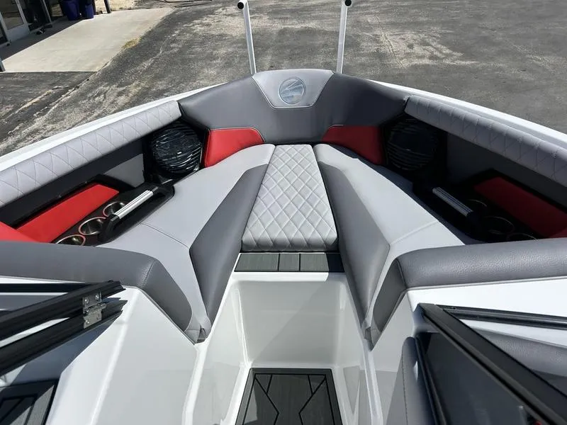 Slide: The Image of 2025 Tigé Z1 boat interior with gray and red seating, diamond-pattern upholstery. - 5