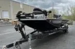 Slide: The Image of 2020 Ranger RT198P boat on trailer, parked outdoors, overcast sky. - 2