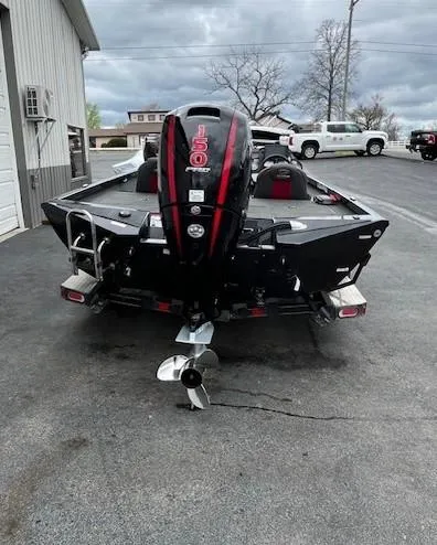Slide: The Image of 2020 Ranger RT198P boat with powerful outboard motor, parked outdoors. - 6
