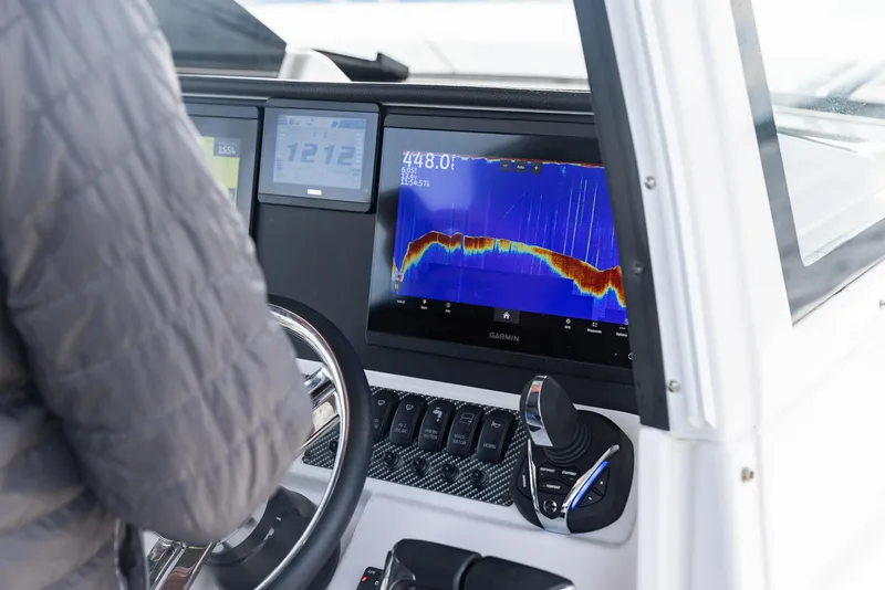 Slide: The Image of Boat dashboard with sonar display on Solara S-310 CW, 2026 model. - 14