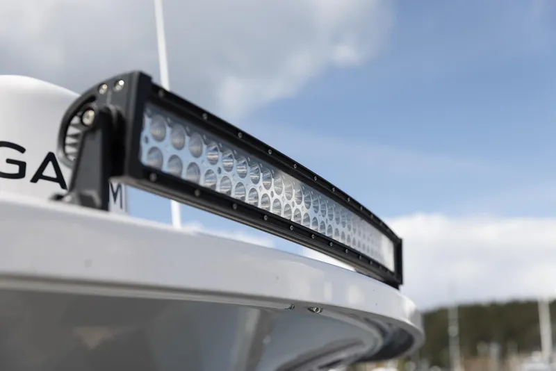 Slide: The Image of Close-up of Solara S-310 CW 2026 boat's LED light bar against a cloudy sky. - 19