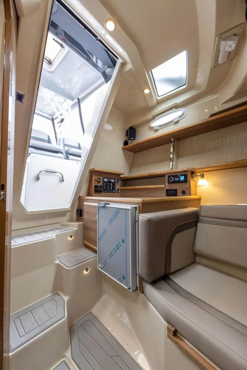 Slide: The Image of Luxurious interior of 2026 Solara S-310 CW boat with modern amenities and elegant design. - 27