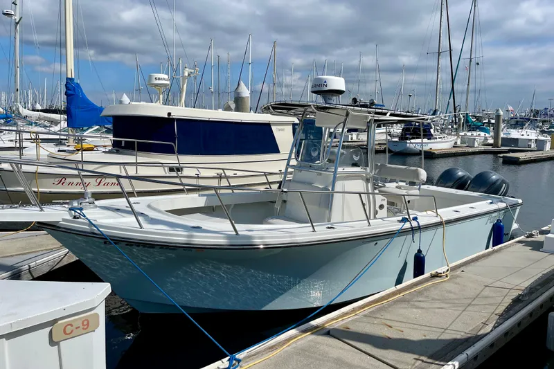 The Image of 2016 Parker 2501 Center Console boat docked at marina. - 0