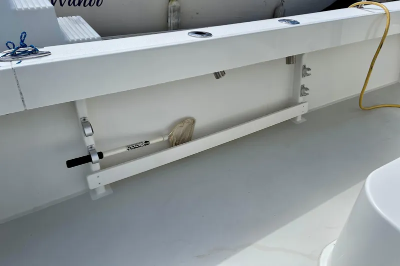 Slide: The Image of 2016 Parker 2501 Center Console boat deck with fishing net storage. - 15