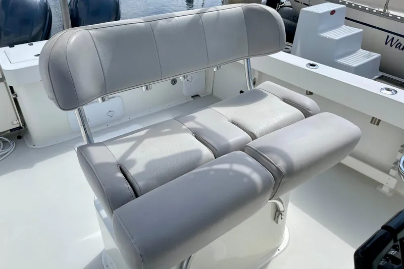 Slide: The Image of 2016 Parker 2501 Center Console boat with cushioned seating. - 19