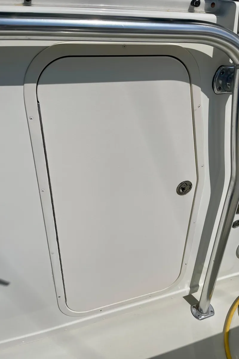 Slide: The Image of 2016 Parker 2501 Center Console boat hatch with stainless steel railing. - 28