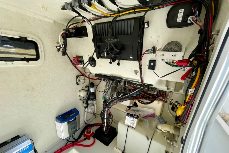 Slide: The Image of Interior wiring of a 2016 Parker 2501 Center Console boat, featuring electronic components and cables. - 31