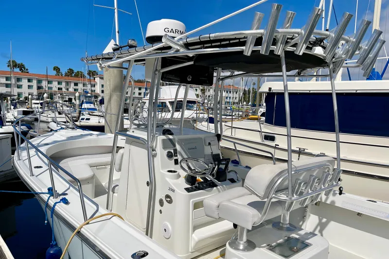 Slide: The Image of 2016 Parker 2501 Center Console boat docked at marina with Garmin equipment. - 7