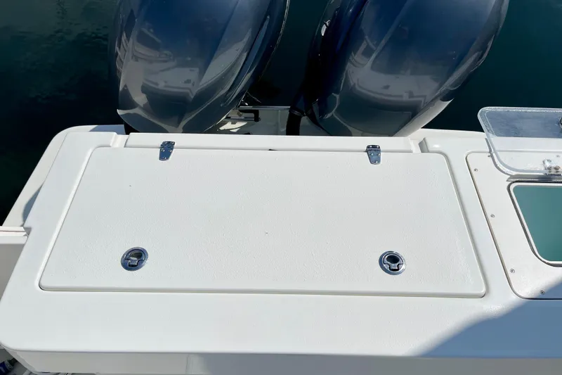 Slide: The Image of 2016 Parker 2501 Center Console boat with dual outboard motors. - 9