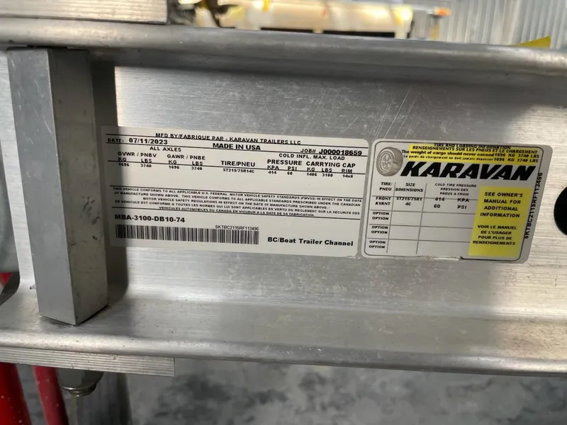Slide: The Image of Label on Karavan trailer, showing specifications and manufacturing details. - 8
