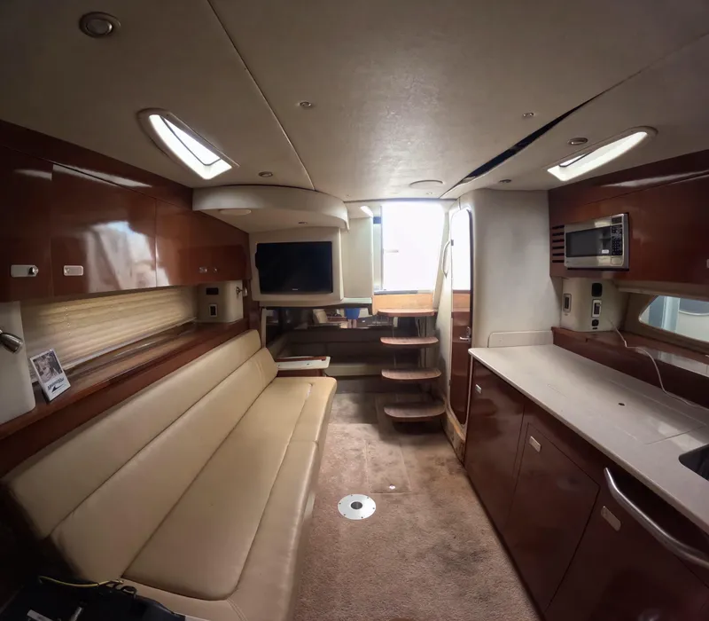 Slide: The Image of Luxurious interior of 2010 Sea Ray 38 yacht with modern amenities and elegant design. - 10