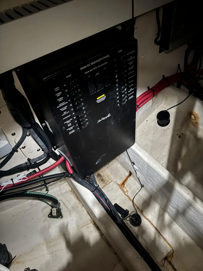 Slide: The Image of Main DC breaker panel in 2010 Sea Ray 38 boat, with visible wiring and connections. - 14