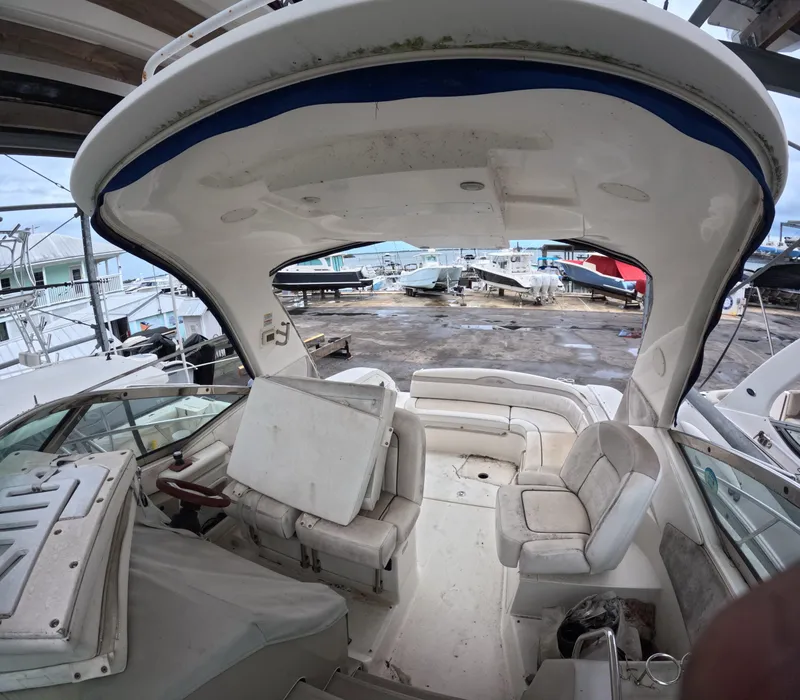 Slide: The Image of Interior view of a 2010 Sea Ray 38 yacht with seating and helm. - 6