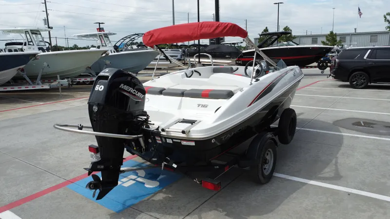 Slide: The Image of 2021 TAHOE TAHT16 boat with Mercury 60 engine, parked in a dealership lot. - 10