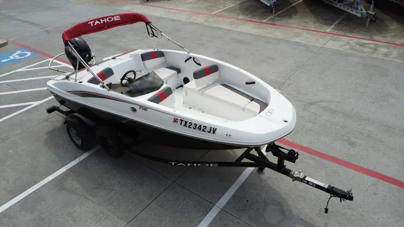 Slide: The Image of 2021 TAHOE TAHT16 boat on trailer in parking lot. - 13