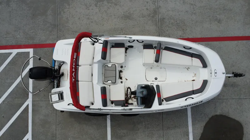 Slide: The Image of Overhead view of a 2021 TAHOE TAHT16 boat parked on concrete. - 19