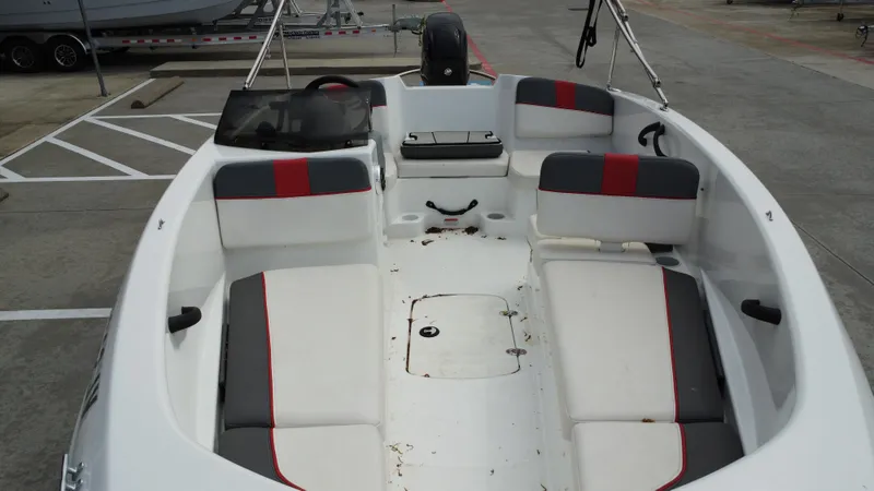 Slide: The Image of 2021 TAHOE TAHT16 boat interior with white and gray seating, red accents. - 20