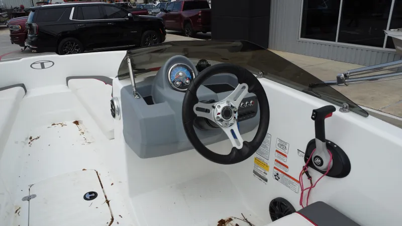 Slide: The Image of 2021 TAHOE TAHT16 boat interior with steering wheel and control panel. - 23