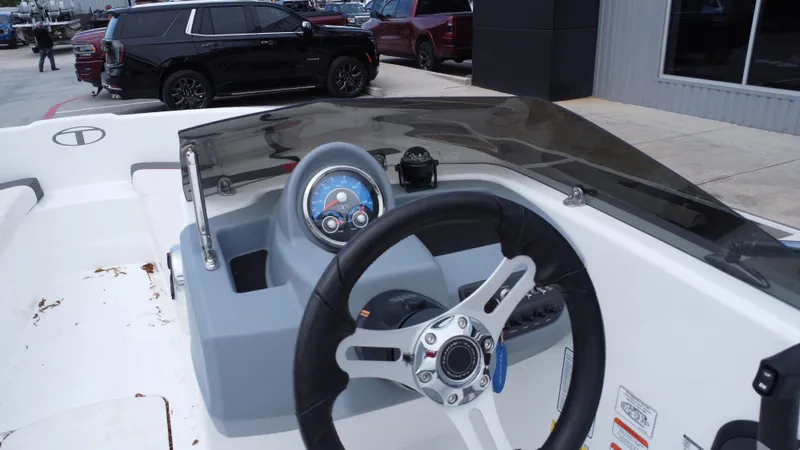 Slide: The Image of Steering console of a 2021 TAHOE TAHT16 boat, featuring a sleek design and modern controls. - 24