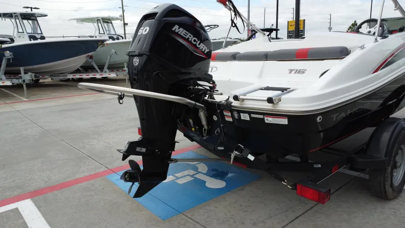 Slide: The Image of 2021 TAHOE TAHT16 boat with Mercury 60 engine on trailer in parking lot. - 25