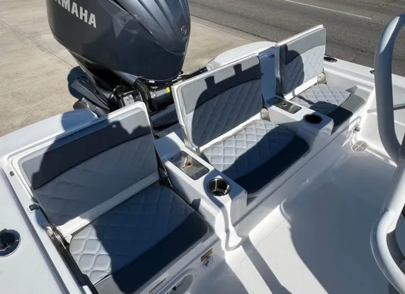 Slide: The Image of 2025 NauticStar 224 Bay boat seats with Yamaha engine, featuring diamond-stitched upholstery. - 4