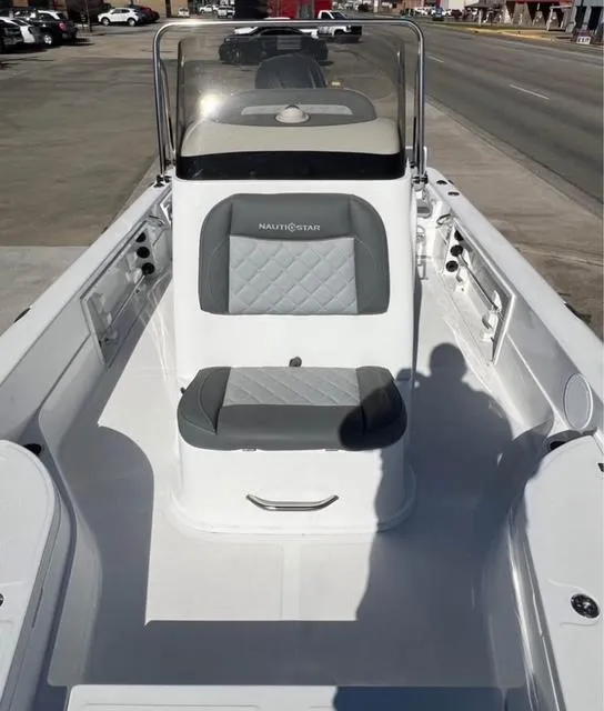 Slide: The Image of 2025 NauticStar 224 Bay boat interior with gray seating and console. - 5