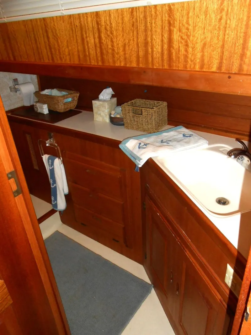 Slide: The Image of 1983 Californian 42 yacht bathroom with wooden cabinetry and sink. - 11