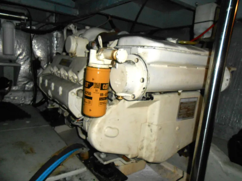 Slide: The Image of Engine room of a 1983 Californian 42 yacht with visible machinery components. - 23