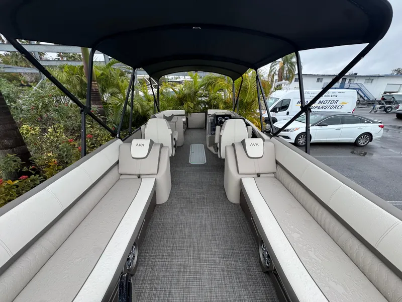 Slide: The Image of 2025 Avalon Catalina Quad Lounge boat interior with spacious seating and canopy. - 14