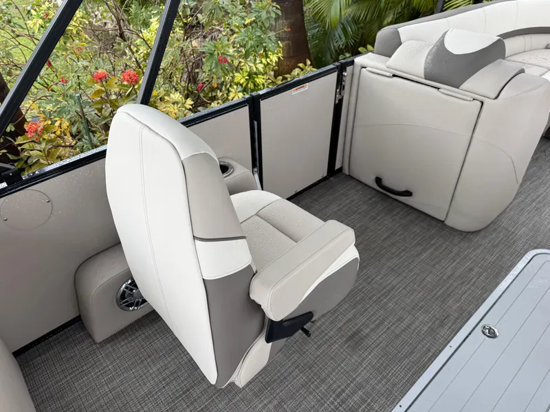 Slide: The Image of 2025 Avalon Catalina Quad Lounge interior with beige seating and gray flooring. - 23