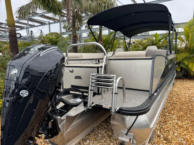 Slide: The Image of 2025 Avalon Catalina Quad Lounge 23' pontoon boat with outboard motor and canopy. - 3