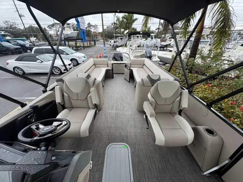 Slide: The Image of 2025 Avalon Catalina Quad Lounge boat interior with plush seating and modern design. - 31