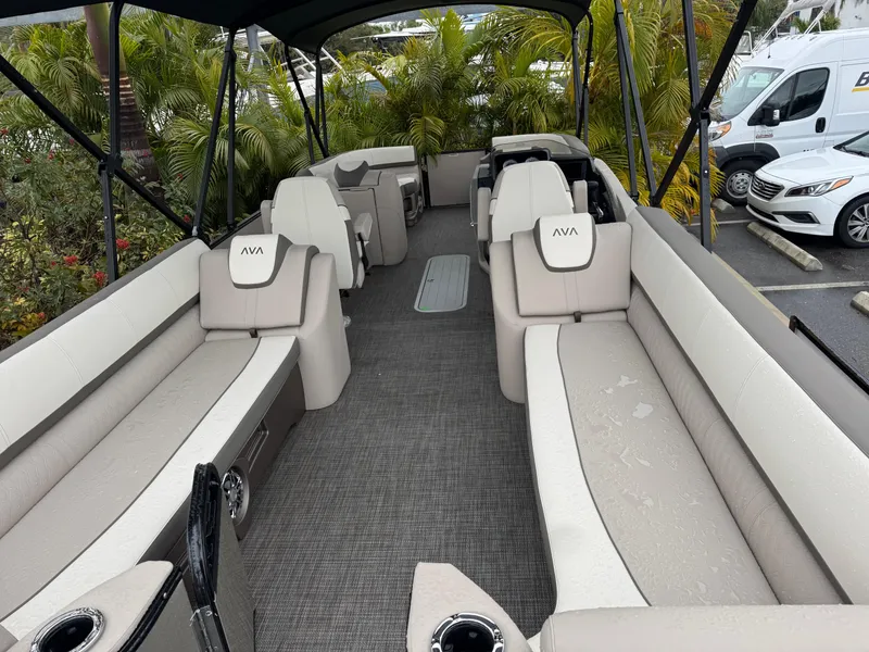 Slide: The Image of 2025 Avalon Catalina Quad Lounge boat interior with spacious seating and modern design. - 9