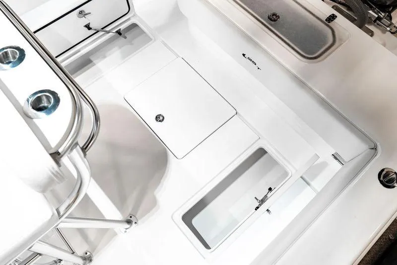 Slide: The Image of 2025 Contender 25T boat deck with storage compartments and stainless steel fixtures. - 15