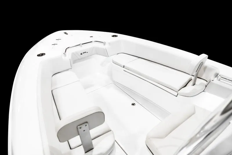 Slide: The Image of 2025 Contender 25T boat interior with white seating and sleek design. - 17