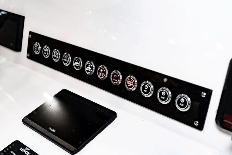 Slide: The Image of Control panel of 2025 Contender 25T boat with labeled buttons and Yamaha display. - 22