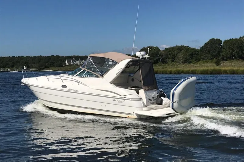 Slide: The Image of 2006 Cruisers Yachts 320 Express boat cruising on a sunny day. - 0