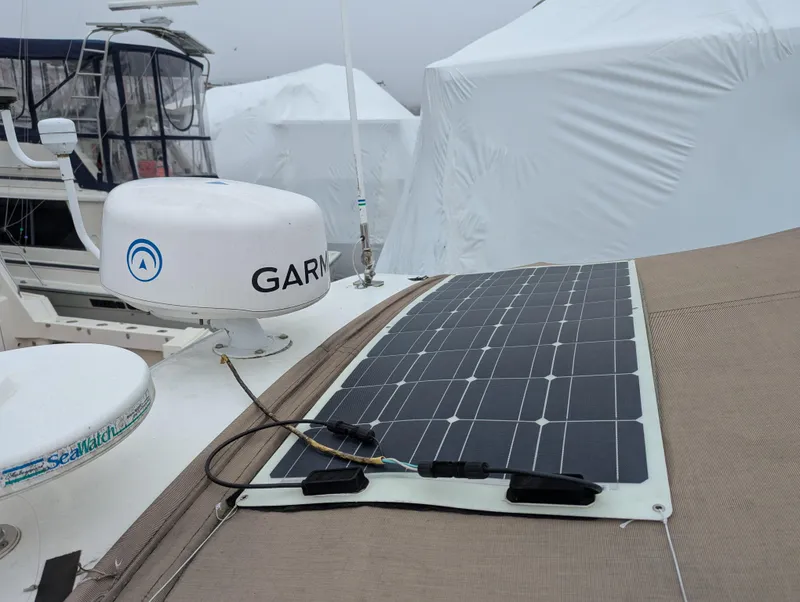 Slide: The Image of 2006 Cruisers Yachts 320 Express with solar panel and Garmin equipment on deck. - 23