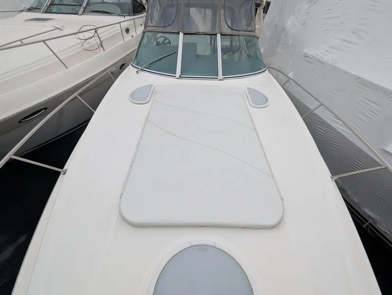 Slide: The Image of 2006 Cruisers Yachts 320 Express boat docked, top view of deck and windshield. - 25