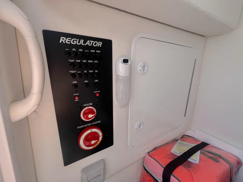 Slide: The Image of Control panel of a 2019 Regulator 25 boat with safety equipment. - 34