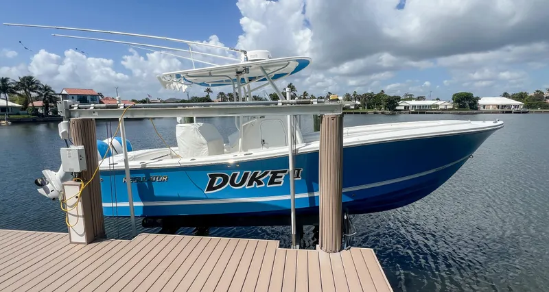 Slide: The Image of 2019 Regulator 25 boat docked on a sunny day with blue skies. - 37